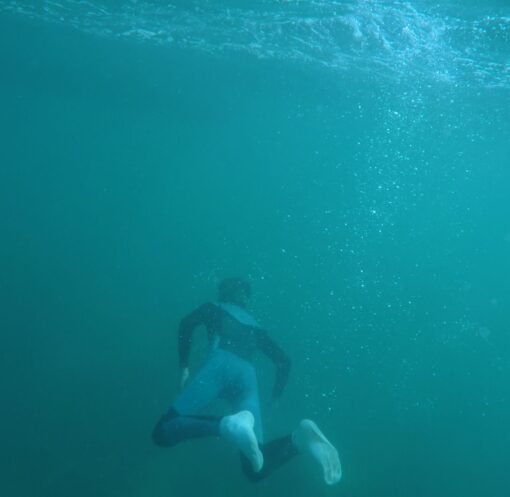 Explore underwater scenes of a snorkeler in a vibrant turquoise ocean, capturing the thrill of diving.
