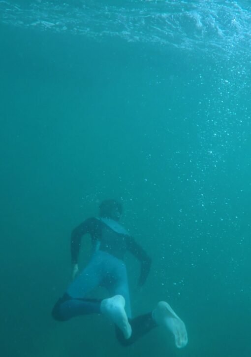 Explore underwater scenes of a snorkeler in a vibrant turquoise ocean, capturing the thrill of diving.