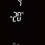 Close-up of electronic screen showing 4°C and -20°C in white digits