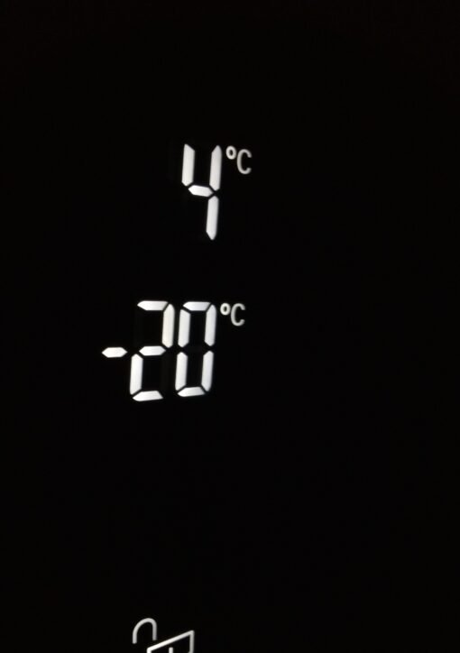 Close-up of electronic screen showing 4°C and -20°C in white digits