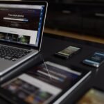 A contemporary workspace showcasing a laptop, tablet, and smartphones, ideal for tech and freelance use.