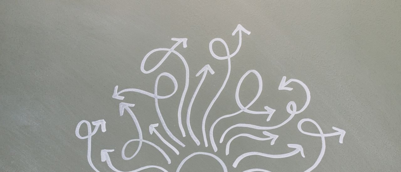 Conceptual chalk drawing illustrating mental health challenges with arrows representing thoughts.