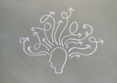 Conceptual chalk drawing illustrating mental health challenges with arrows representing thoughts.