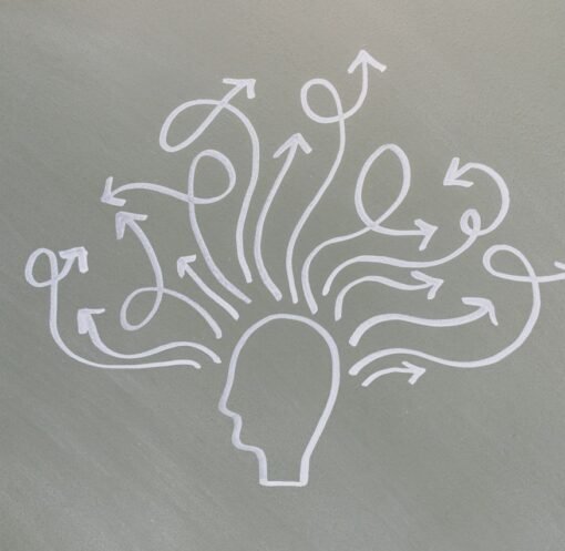 Conceptual chalk drawing illustrating mental health challenges with arrows representing thoughts.