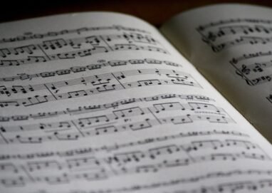 Detailed close-up of a music sheet showing complex musical notes and compositions.