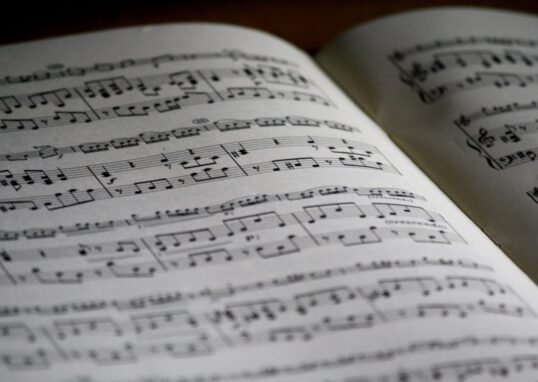 Detailed close-up of a music sheet showing complex musical notes and compositions.