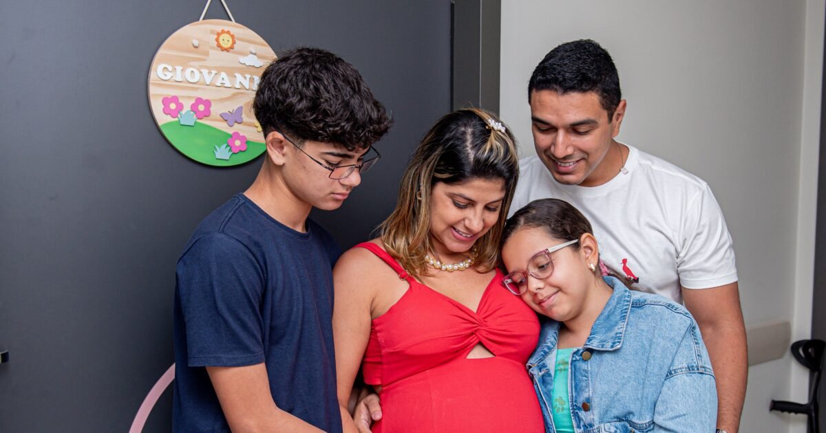 Joyful family gathering, embracing new beginnings with a baby on the way.