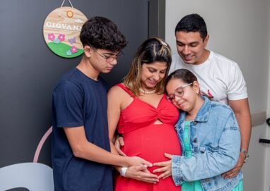 Joyful family gathering, embracing new beginnings with a baby on the way.