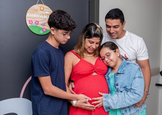 Joyful family gathering, embracing new beginnings with a baby on the way.