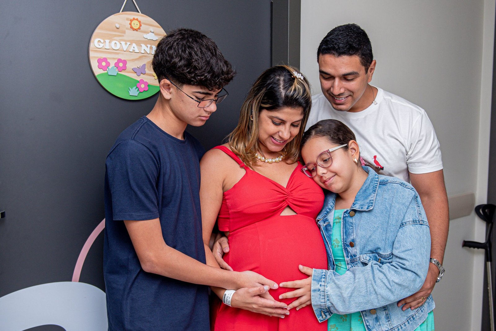 Joyful family gathering, embracing new beginnings with a baby on the way.