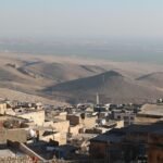 Breathtaking aerial view of Mardin's unique cityscape and surrounding landscapes in Turkey.