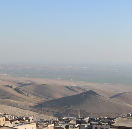 Breathtaking aerial view of Mardin's unique cityscape and surrounding landscapes in Turkey.