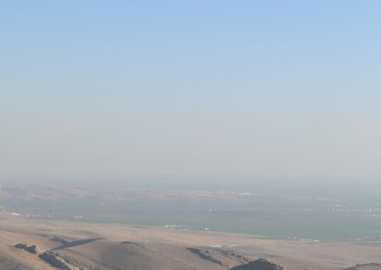 Breathtaking aerial view of Mardin's unique cityscape and surrounding landscapes in Turkey.