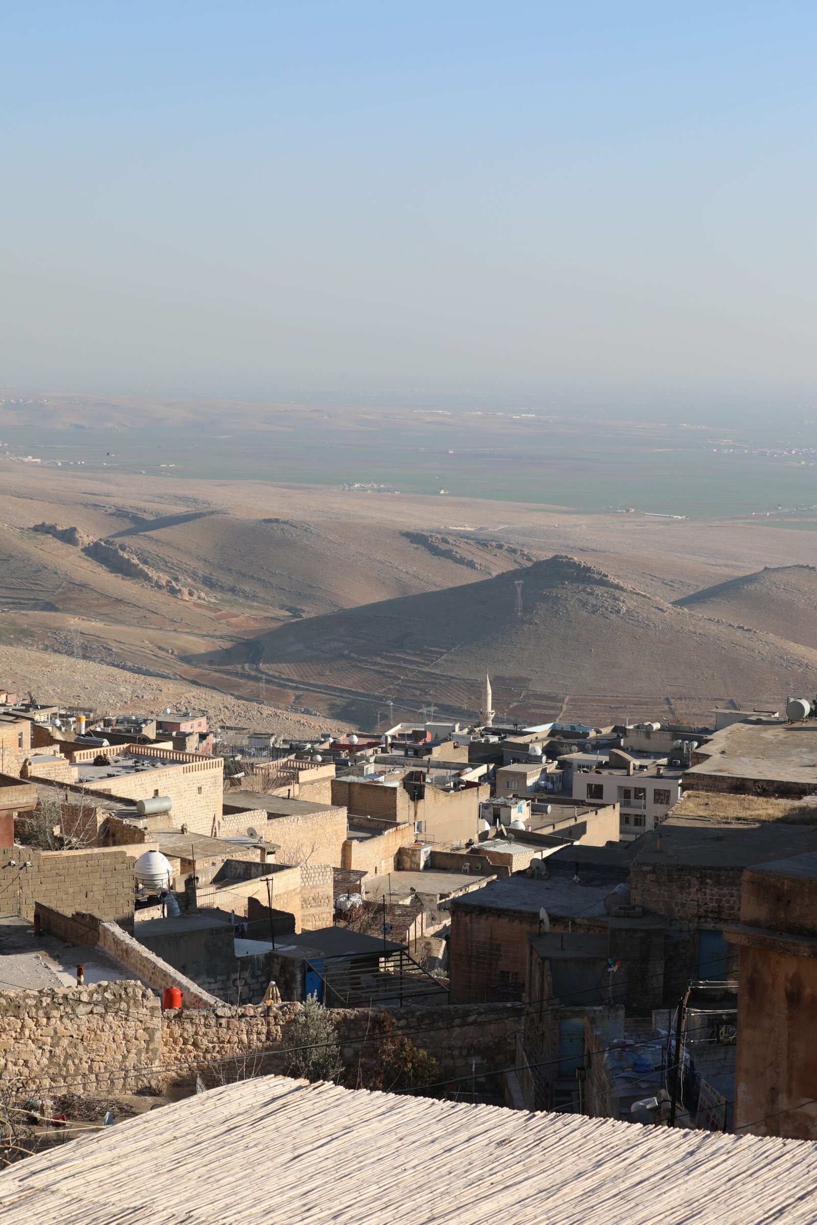 Breathtaking aerial view of Mardin's unique cityscape and surrounding landscapes in Turkey.