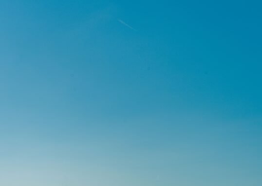 Calm blue waters of the Mediterranean Sea with a clear sky, captured near the Balearic Islands, Spain.