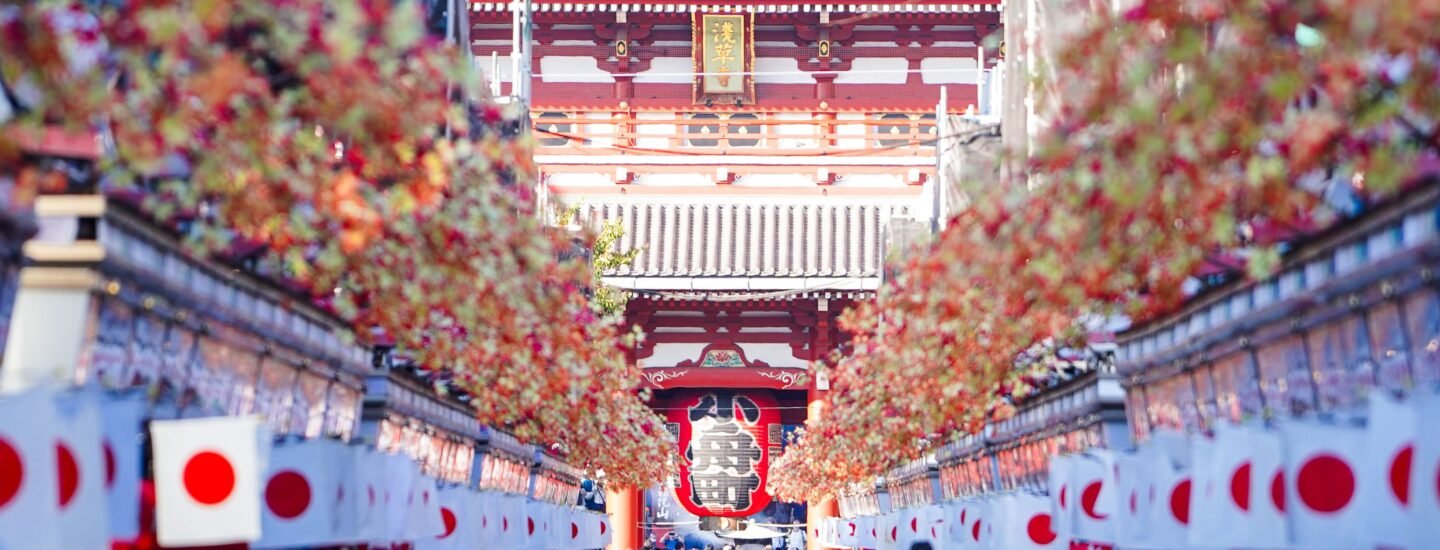 Vibrant crowd at Sensō-ji Temple in Asakusa, Tokyo, during a festive day.