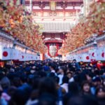 Vibrant crowd at Sensō-ji Temple in Asakusa, Tokyo, during a festive day.