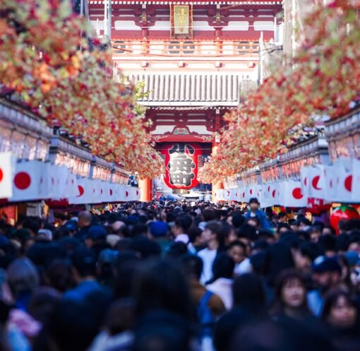 Vibrant crowd at Sensō-ji Temple in Asakusa, Tokyo, during a festive day.