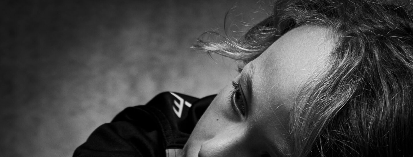 Expressive black and white portrait of a child deep in thought and contemplation.